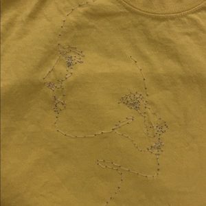 yellow t shirt! i sewed a design on it.